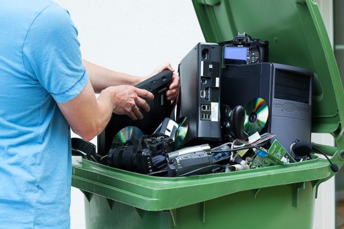 Trucks removing items from a garage