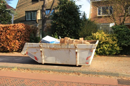 Man and van team preparing items for removal on a Holborn street